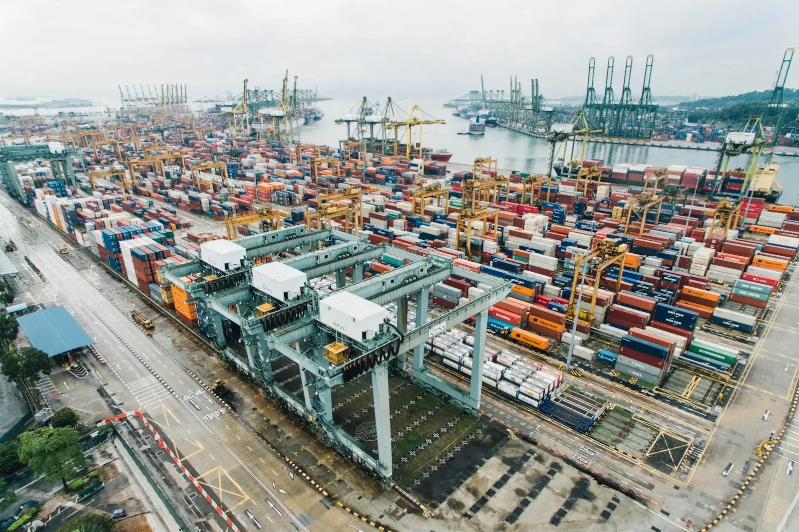 Aerial view of a container port with stacked freight containers