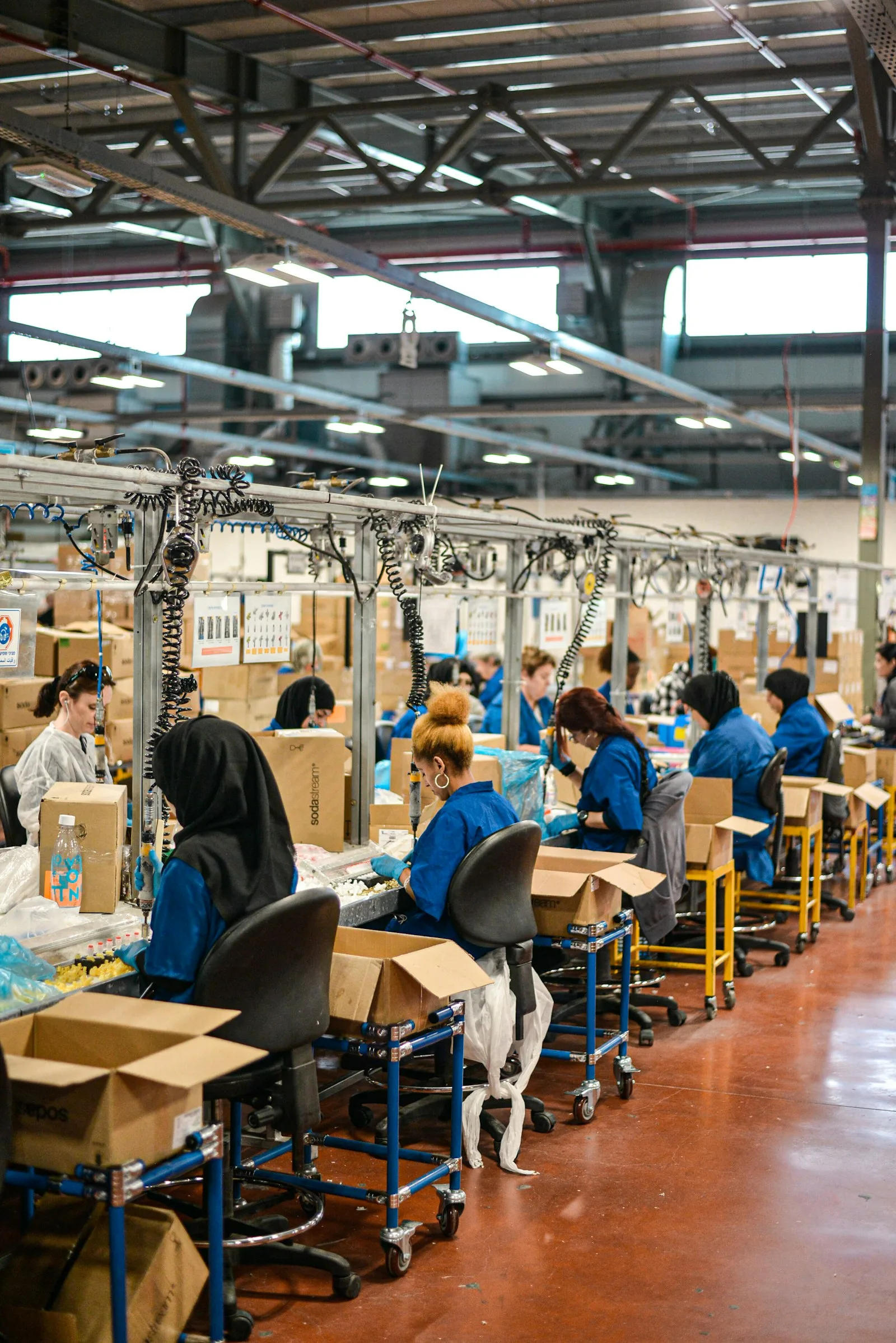 People working at an assembly line in a factory